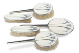 An Art Deco silver and guilloche enamel five piece dressing table set comprising a hand mirror,