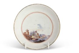 A Meissen saucer circa 1740 painted with a landscape scene, the reverse with puce ground (repair