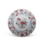 An 18th Century Chinese porcelain famille rose plate, the centre decorated with a vase of flowers