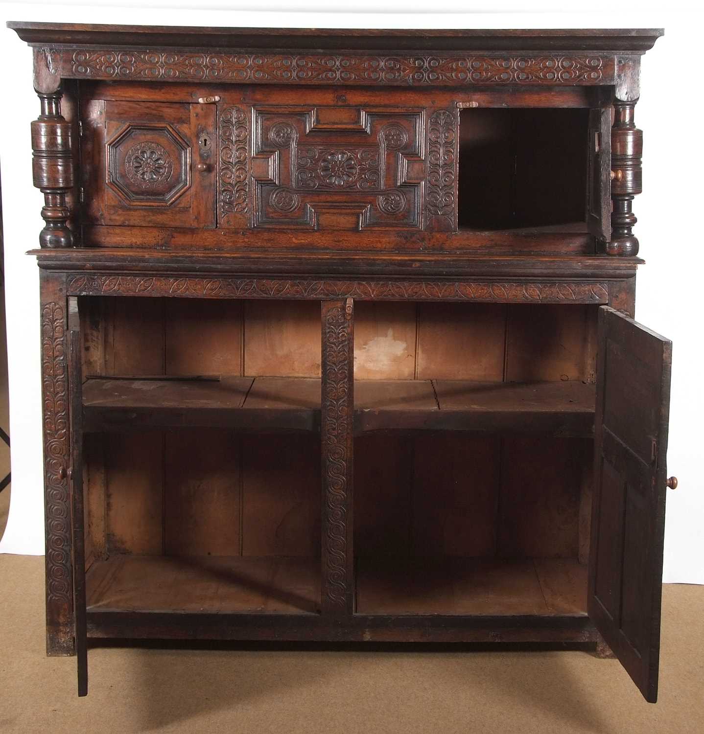 A large 17th Century oak court cupboard with moulded cornice over a top section with two panelled - Image 6 of 12