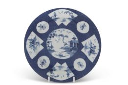 A Bow porcelain small plate on a stand, the blue ground with Chinoiserie decoration, pseudo