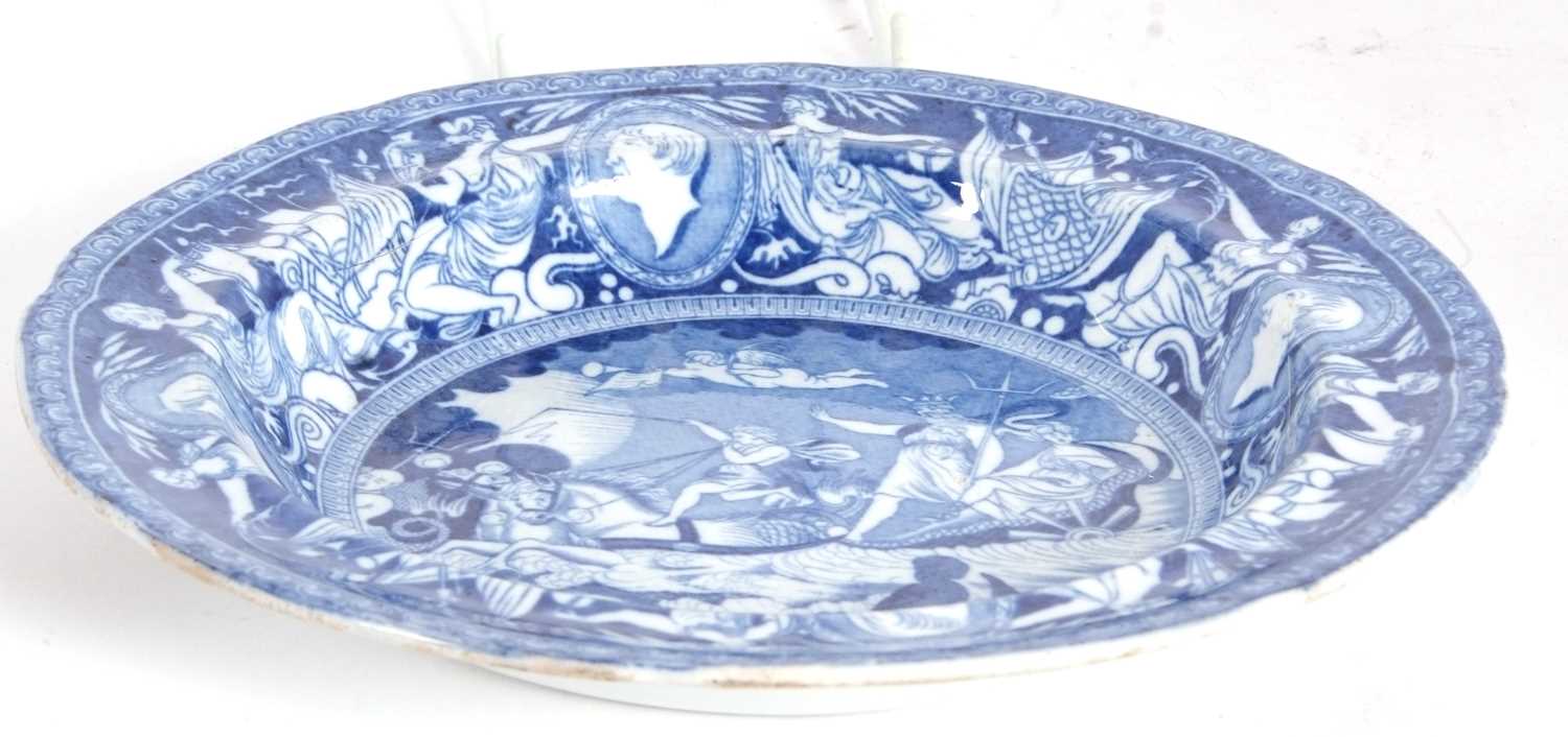 A rare pearlware plate c1810 printed in underglaze blue with an allegorical scene of Nelson being - Image 3 of 4