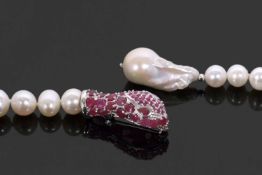 A cultured pearl and ruby snake head lanyard style necklace, the strand cultured pearls, with 30mm