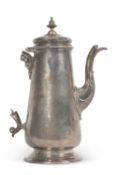 A George II silver coffee pot of plain and gentle balustre shape on to a spreading foot, with a cast