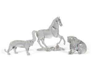 A Swarovski model of a prancing horse on shaped base together with a model of a bear and a tiger,