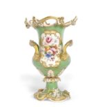A 19th Century Coalport style vase, the central panel finely painted with floral spray on cream