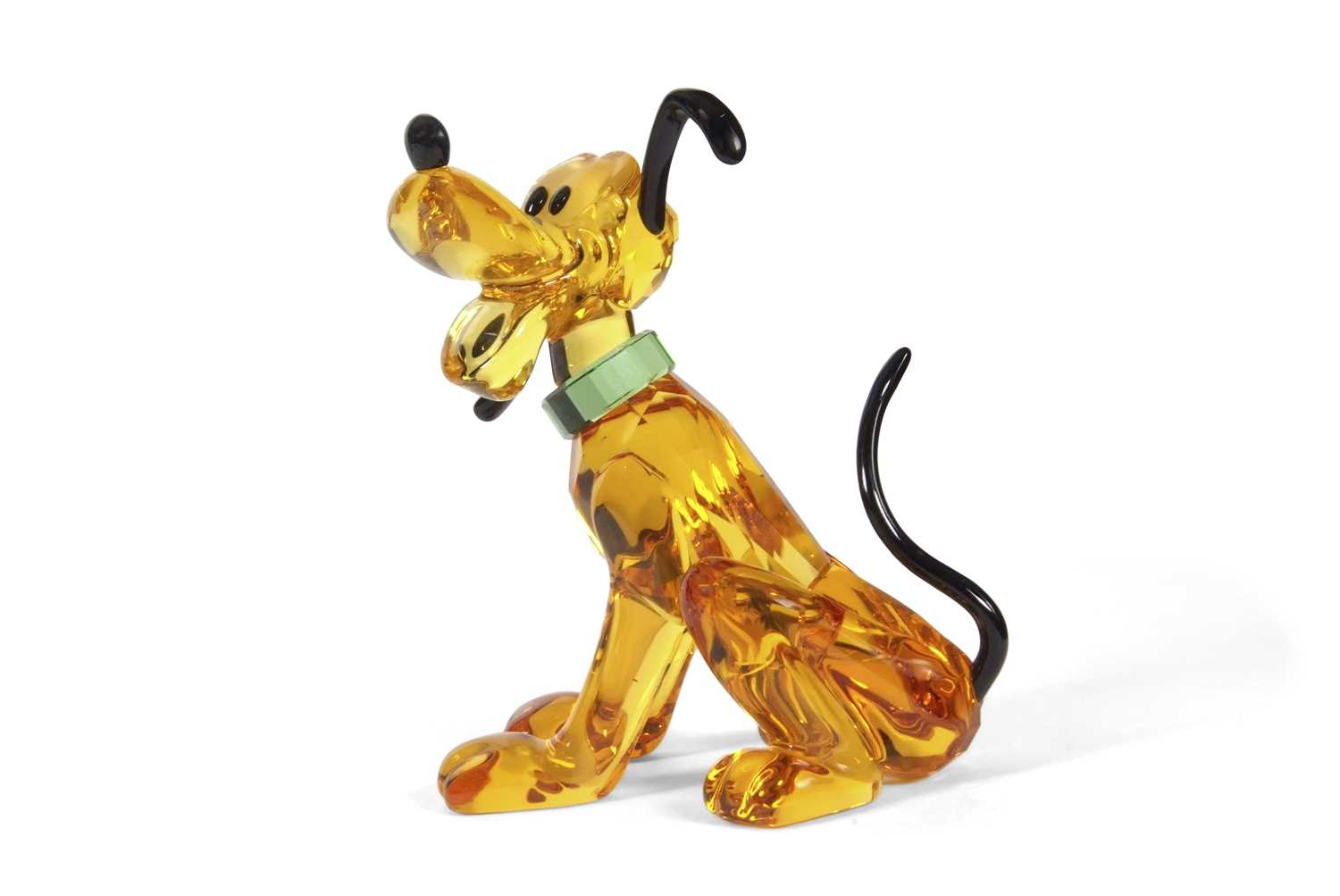 A Swarovski Disney figure of Pluto with yellow colour, black ears and tail, with original box, 9cm
