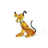 A Swarovski Disney figure of Pluto with yellow colour, black ears and tail, with original box, 9cm