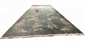 Large contemporary Chinese green ground carpet decorated with stylised foliage 23ft 9" x 12ft 1"