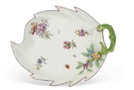 A Chelsea porcelain leaf dish with shaped rim and green stalk handle decorated in Meissen style with