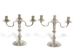 A pair of small silver three light candelabra in Queen Anne style, the three lights are removeable