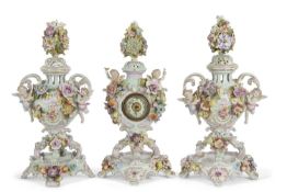 A garniture of late 19th Century continental porcelain pot pourri vases with applied floral and