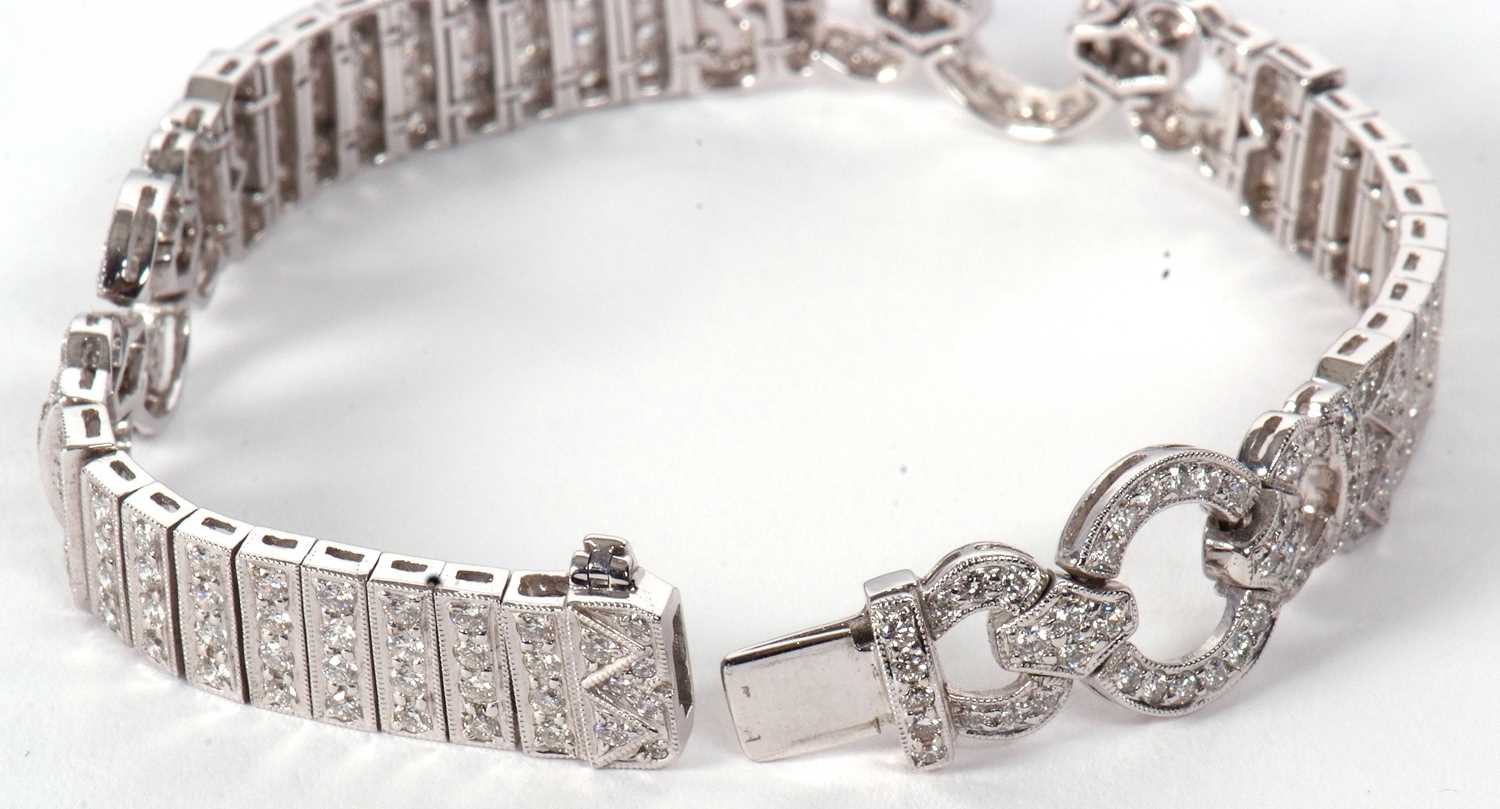 An 18ct white gold and diamond Art Deco style bracelet, comprised of three circlets of small round - Image 10 of 14