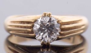 An 18ct single stone diamond ring, the round early 20th century brilliant cut diamond, estimated