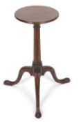 A small George III wine table or kettle stand with circular top over a tapering column and tripod