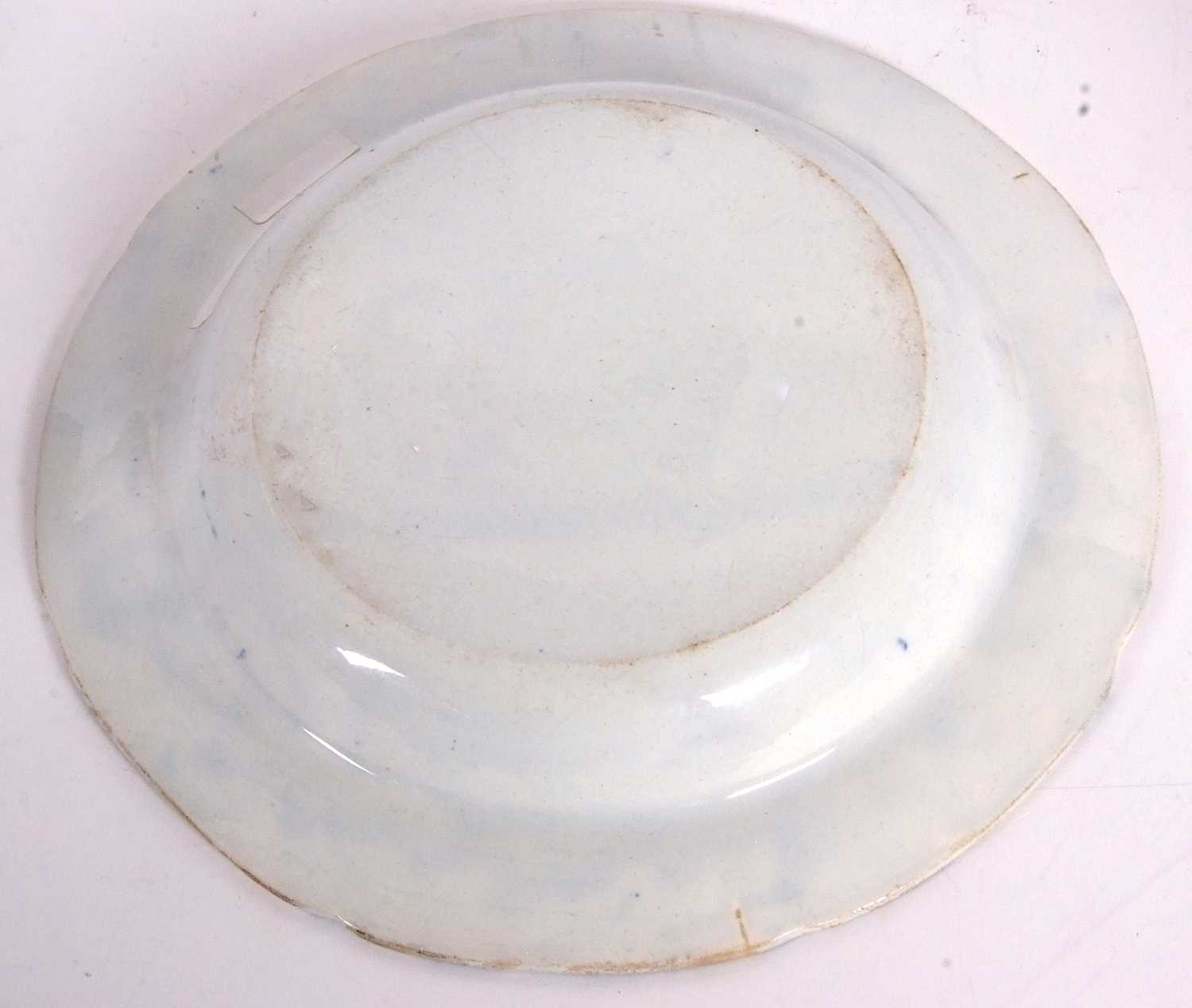 A rare pearlware plate c1810 printed in underglaze blue with an allegorical scene of Nelson being - Image 4 of 4