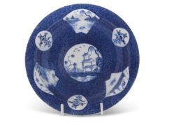 A Lowestoft or Bow porcelain plate, circa 1765, the light blue ground with Chinoiserie decoration