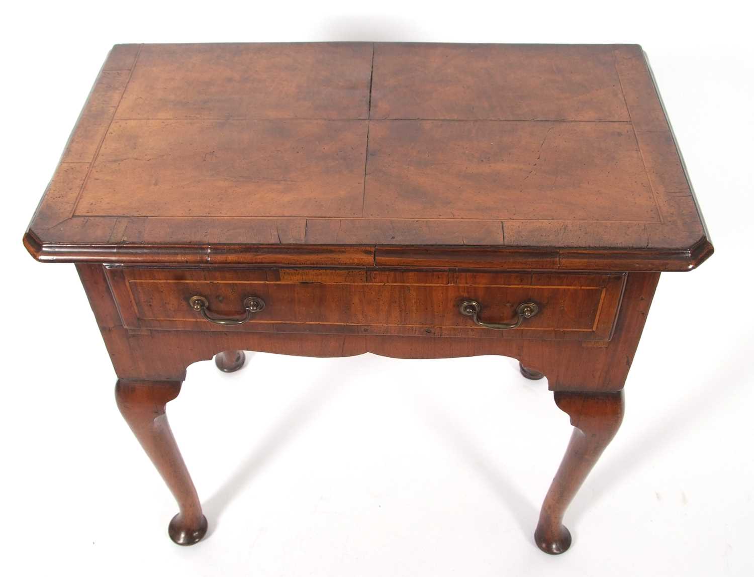 An early 18th Century walnut low boy, the top with quartered veneers and canted front corners over a - Image 5 of 10