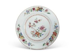 A large 18th Century Chinese porcelain plate decorated in famille rose style, the centre with