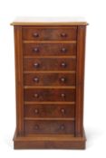 A Victorian mahogany Wellington style chest with seven drawers with turned knob handles, 48cm