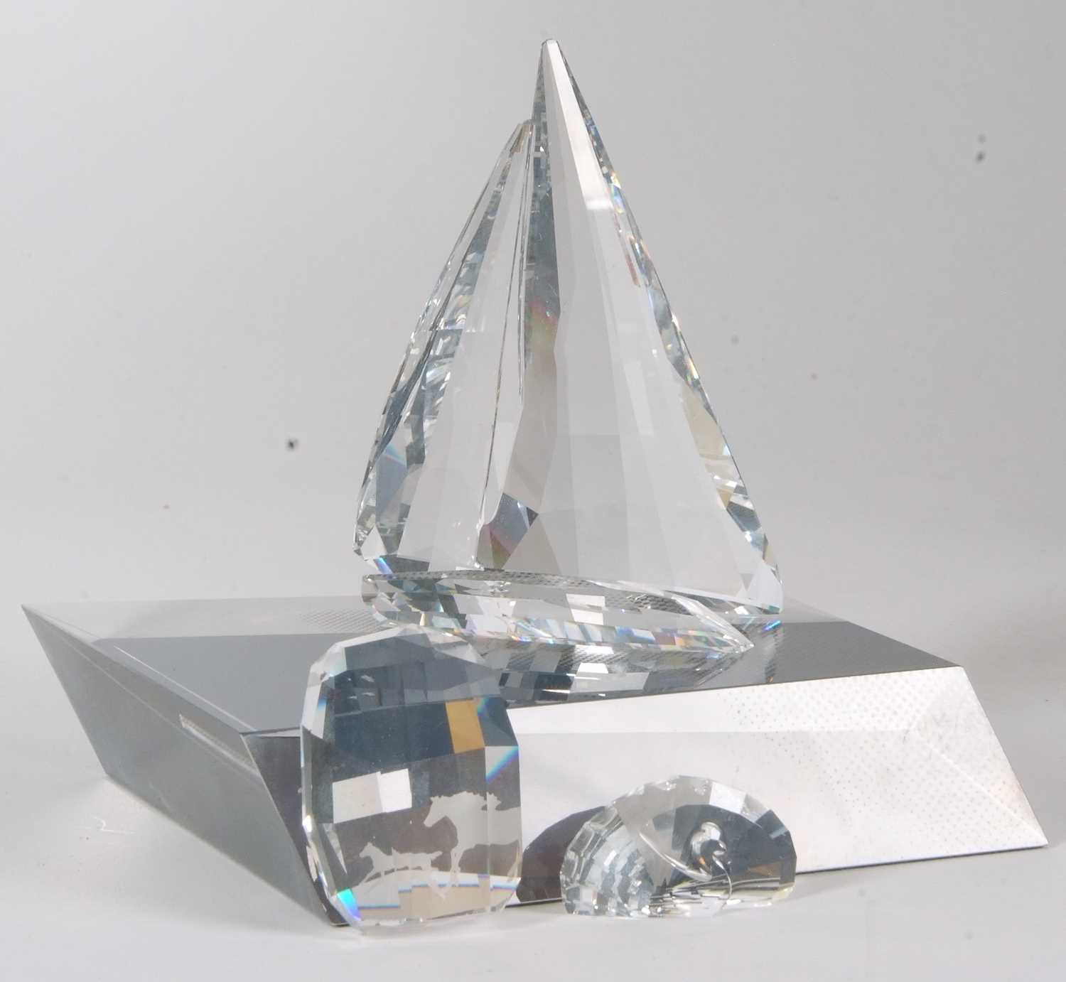 A Swarovski model of a yacht on fitted stand together with two small Swarovski paperweights, one - Image 3 of 4