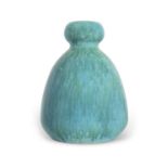 A Ruskin vase with baluster body with a mottled green streaked design, 23cm high