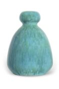 A Ruskin vase with baluster body with a mottled green streaked design, 23cm high