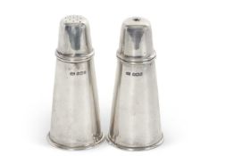 A hallmarked silver salt and pepper of plain lighthouse form, pull off lids, engraved beneath with