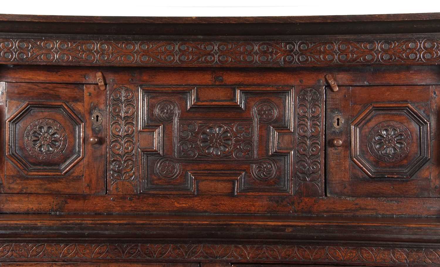 A large 17th Century oak court cupboard with moulded cornice over a top section with two panelled - Image 11 of 12