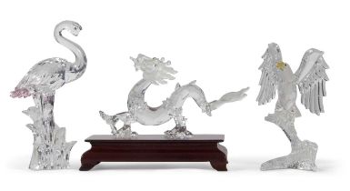 A Swarovski crystal Zodiac model for the year of the Dragon on rectangular wooden plinth together