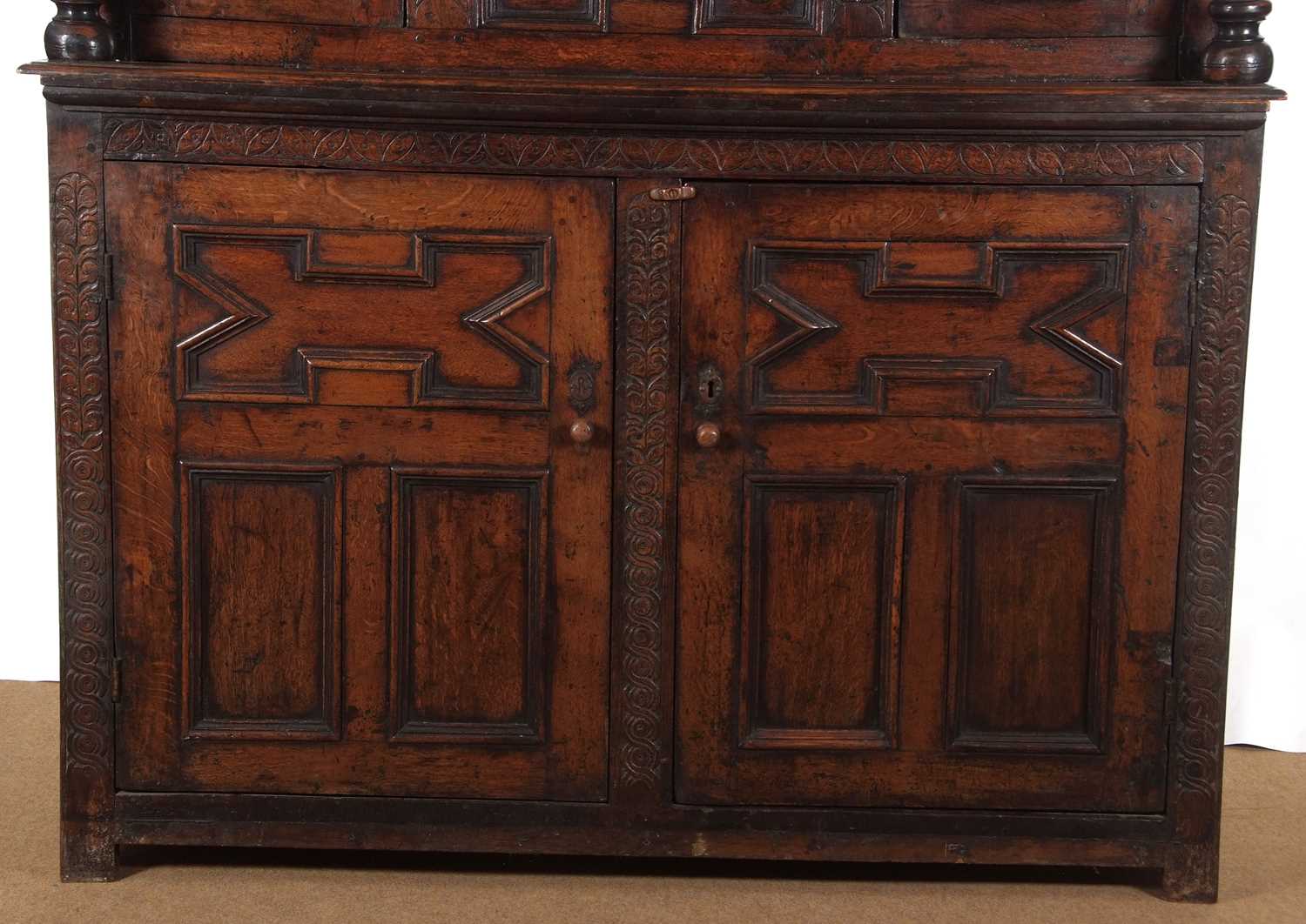 A large 17th Century oak court cupboard with moulded cornice over a top section with two panelled - Image 10 of 12