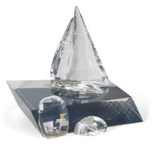 A Swarovski model of a yacht on fitted stand together with two small Swarovski paperweights, one