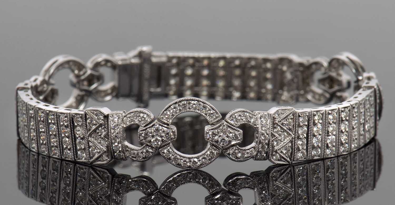 An 18ct white gold and diamond Art Deco style bracelet, comprised of three circlets of small round - Image 3 of 14