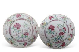 A pair of mid 18th Century Chinese porcelain famille rose plates decorated with floral sprays,
