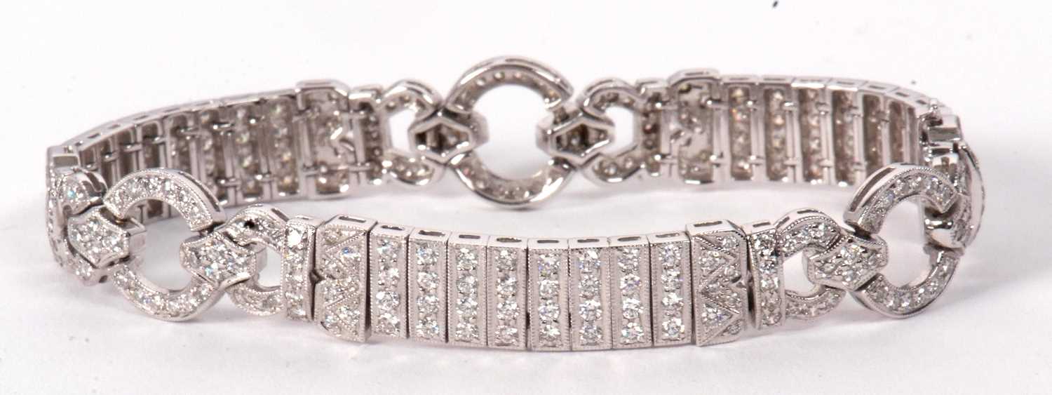 An 18ct white gold and diamond Art Deco style bracelet, comprised of three circlets of small round - Image 14 of 14