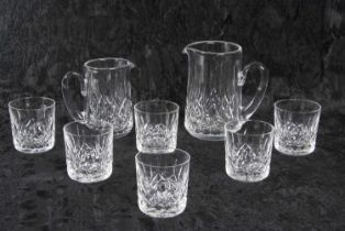 A collection of Waterford glass in the Lismore pattern comprising water jug and smaller jug and
