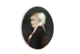 A KPM style 19th Century oval porcelain plaque finely painted with a portrait of a young girl,