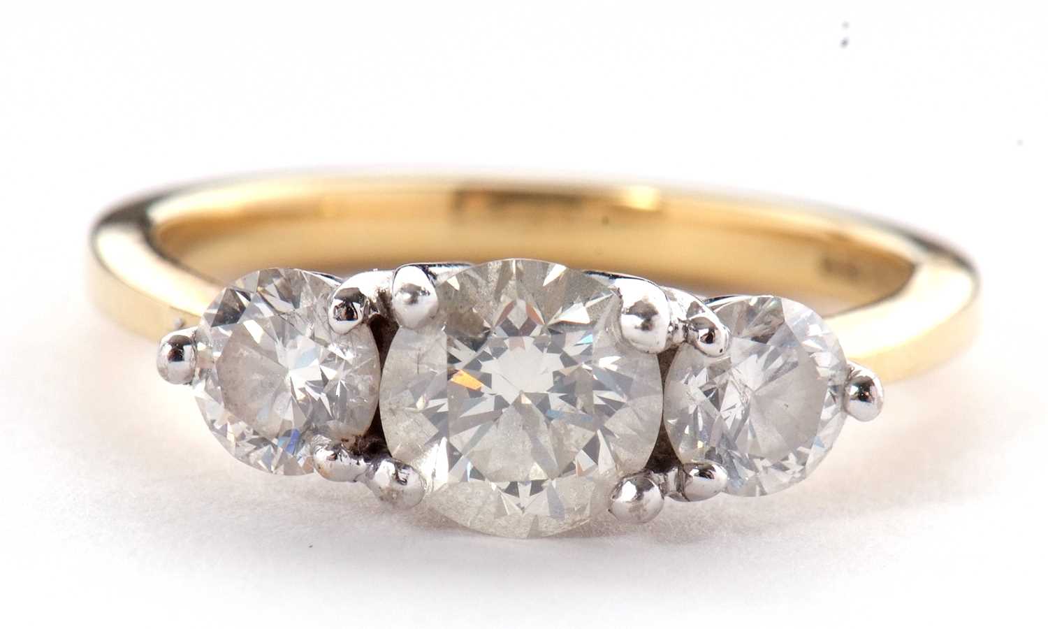 An 18ct three stone diamond ring, the three slightly graudated round brilliant cut diamonds, total - Image 5 of 11