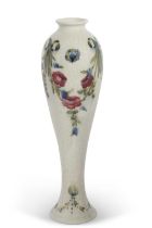 An early 20th Century Moorcroft vase, the slender baluster body decorated with swags of floral