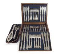 A cased set of Victorian silver fish eaters (eighteen pairs), having decorated scroll engraved