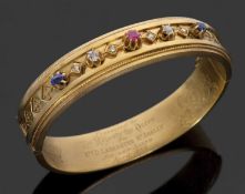 A Queen Victoria presentation bangle, the hinged bangle, 13mm wide, set to centre with a claw