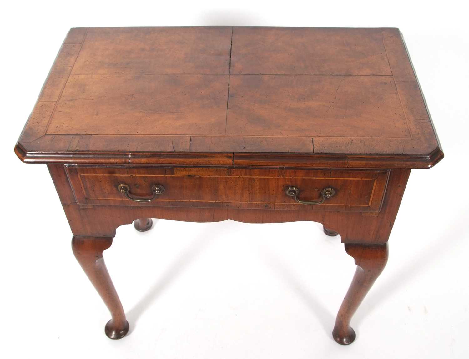 An early 18th Century walnut low boy, the top with quartered veneers and canted front corners over a - Image 10 of 10