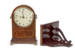 McCabe - A Georgian mahogany cased bracket clock set in an arched case inlaid decoration, brass side