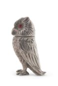A Victorian novelty silver pepper in the form of a standing owl, having pink glass eyes and pull off