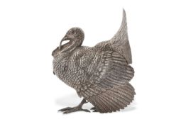 An early 20th Century model of a silver turkey, designed with an etched and chased body (plumage),