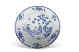 A Chinese porcelain large plate decorated in blue and white, Qianlong period, the centre painted