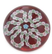 A Clichy paperweight with a garland of flowers