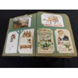 Old battered postcard album containing 330 plus picture postcards, various subjects including