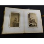 Small Victorian Carte de Visite album containing 48 photos including Queen Victoria and Albert, King