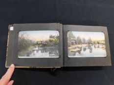 Japanese card album containing 48 hand tinted postcards